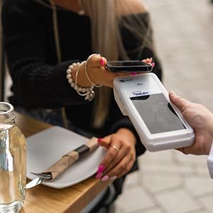 Apple Pay and Google Pay paying at restaurant with mobile